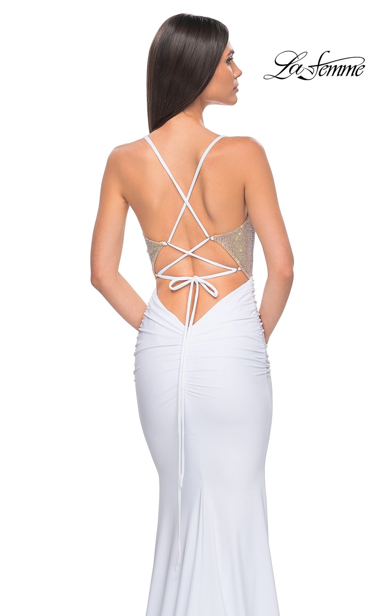 A woman models the La Femme Embellished-Bodice Long Prom Dress 32260—white, fitted, with a corset-style bodice, crisscross open back, and thin straps—against a white background.